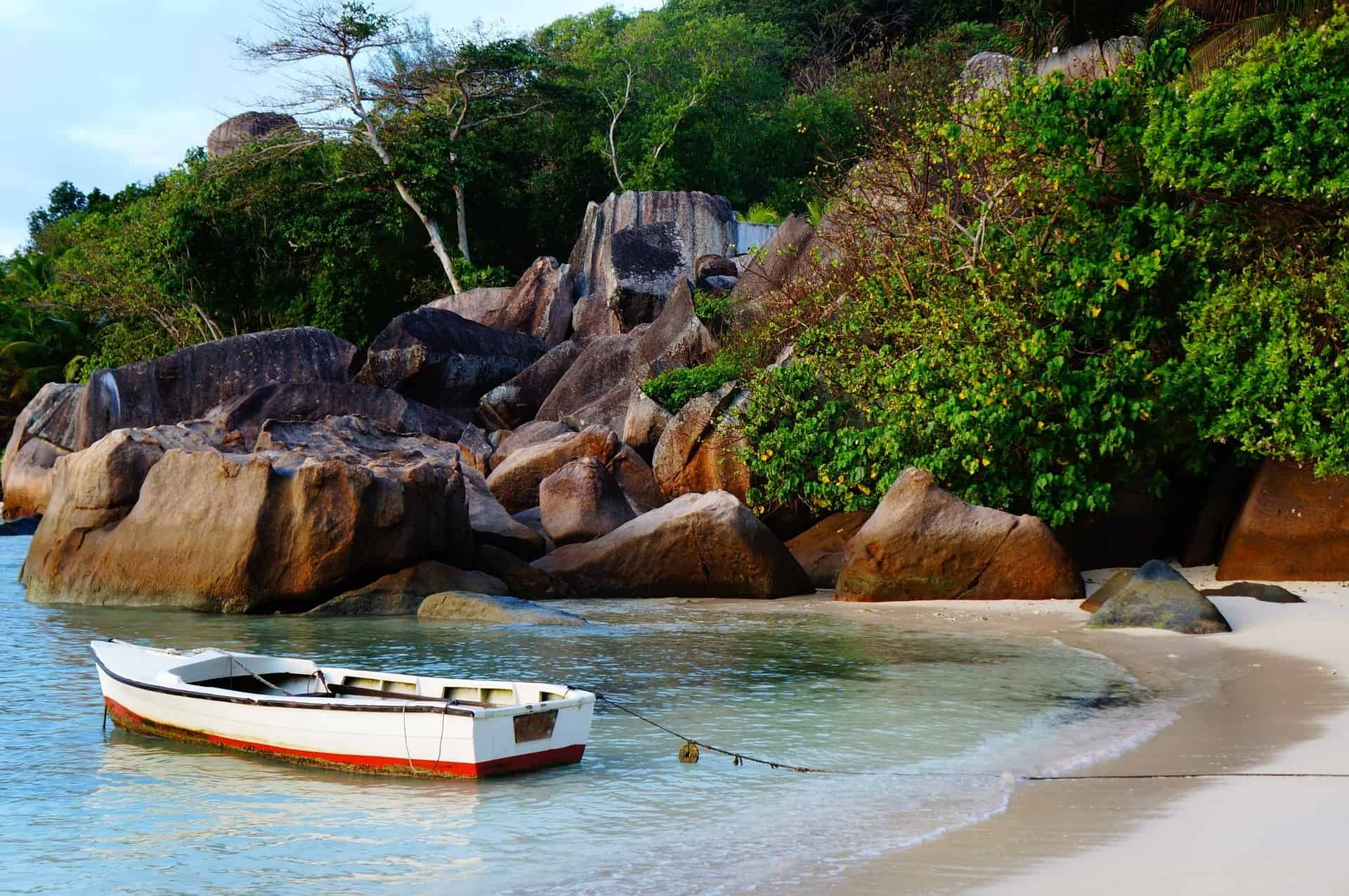 Small boat at a beach of Mahé Island, Seychelles.