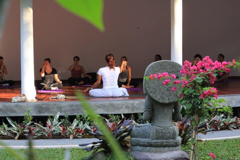 Yoga session at the De Moksha Eco Friendly Boutique Resort in Tanah Lot in Bali, Indonesia.