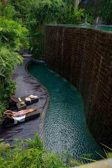 Pool of the De Moksha Eco Friendly Boutique Resort in Tanah Lot in Bali, Indonesia.
