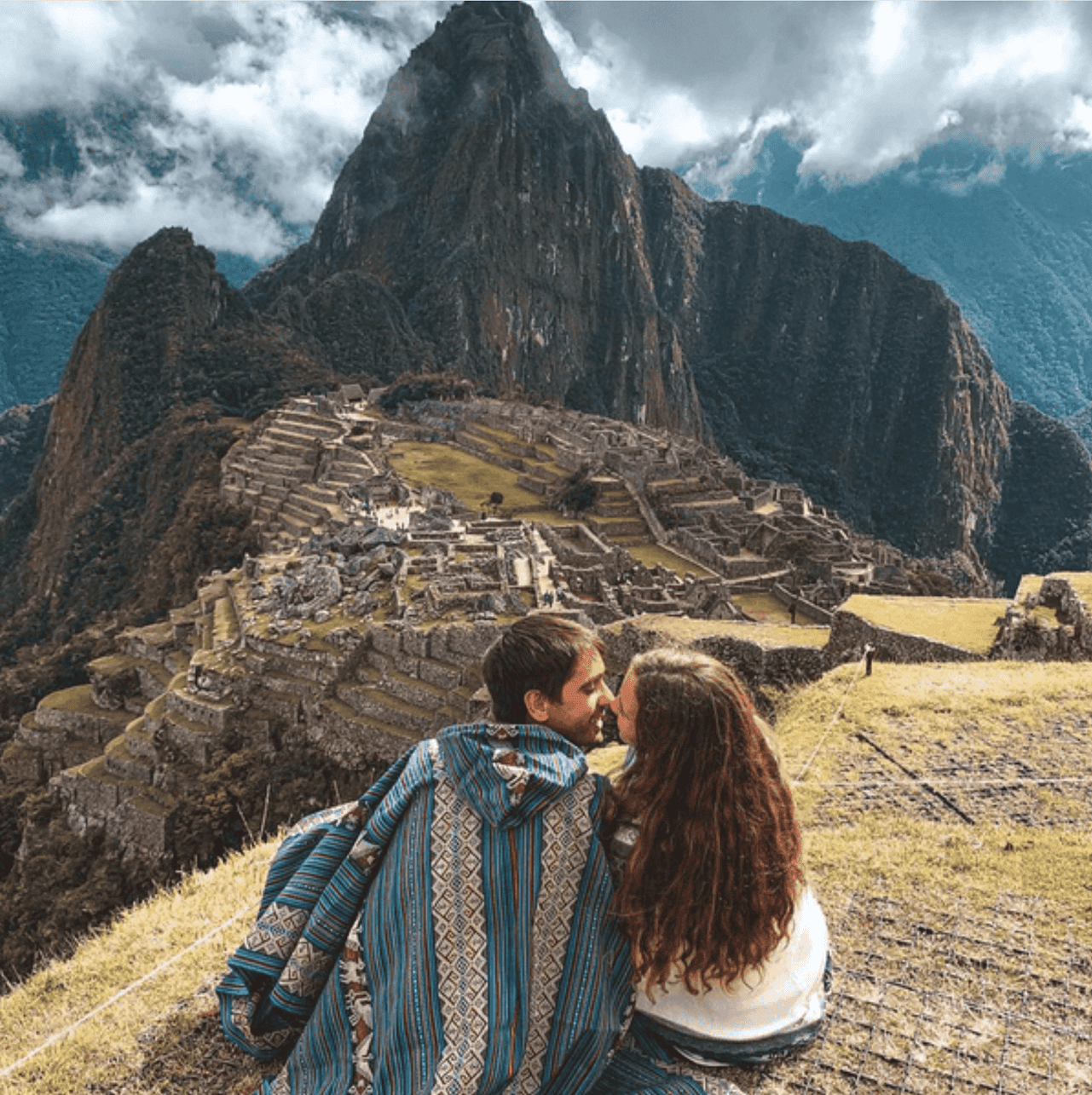 A couple visiting Machu Picchu in Peru.