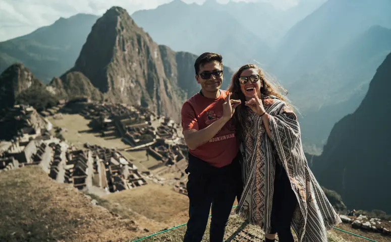 Couple at Machu Picchu - exploor Peru. How to avoid altitude sickness.