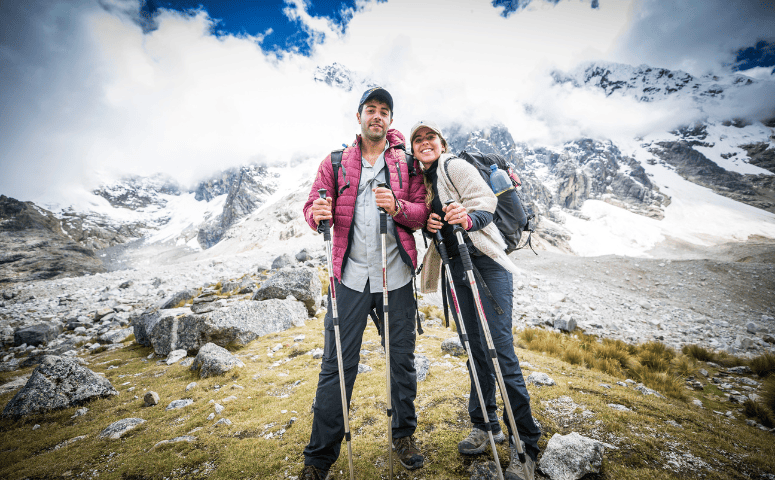 Couple hiking in the mountains. How to avoid altitude sickness.