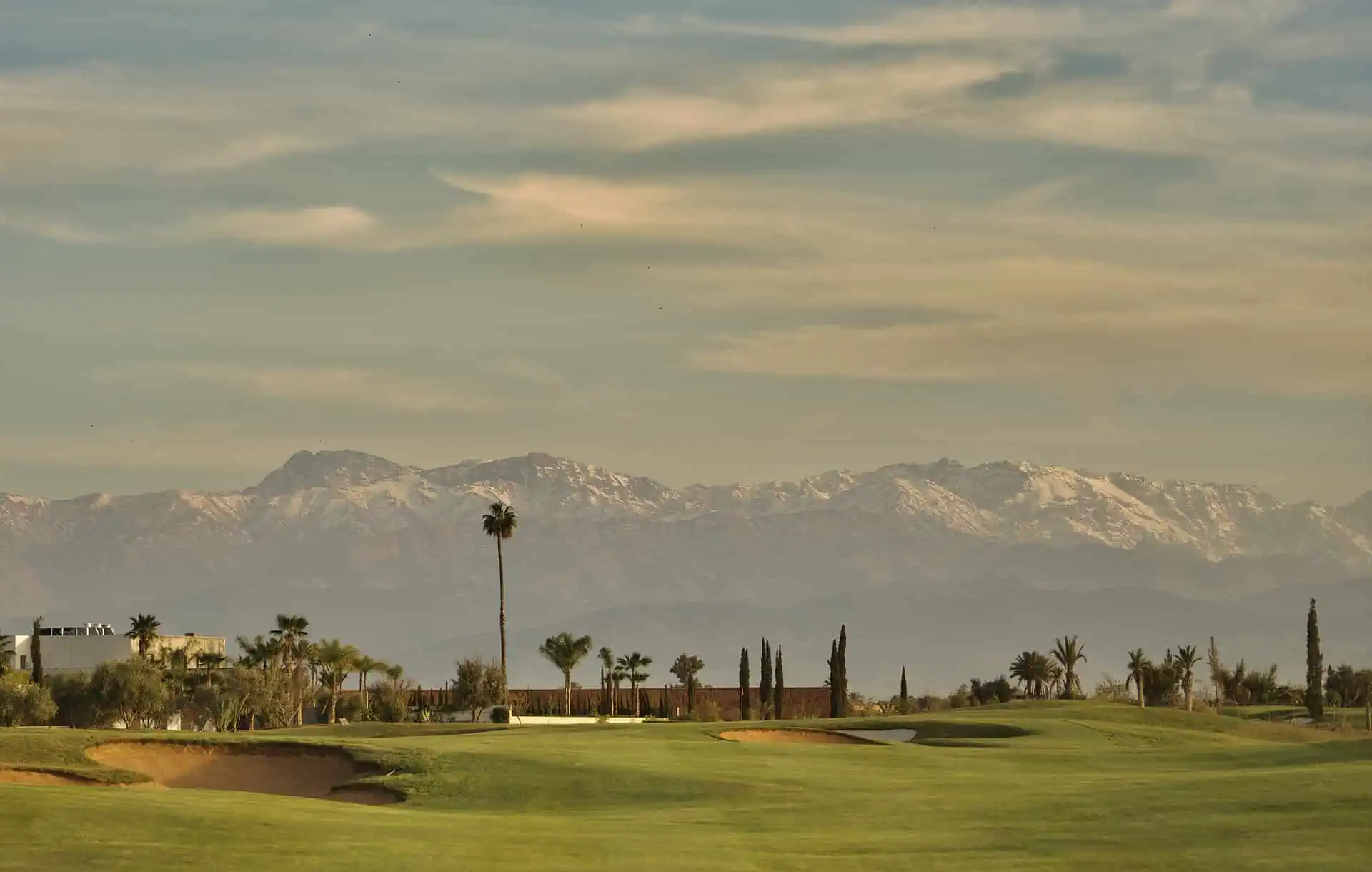 The Atlas Mountains and the Al Maaden Golf Course Marrakech in Morocco.